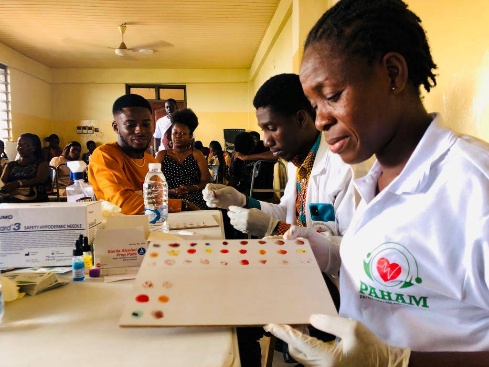 A PAHAM community health screening session in progress